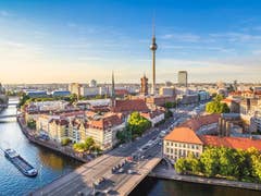 Berlin skyline panorama with TV tower and Spree river at sunset, Germany