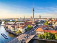 Berlin skyline panorama with TV tower and Spree river at sunset, Germany
