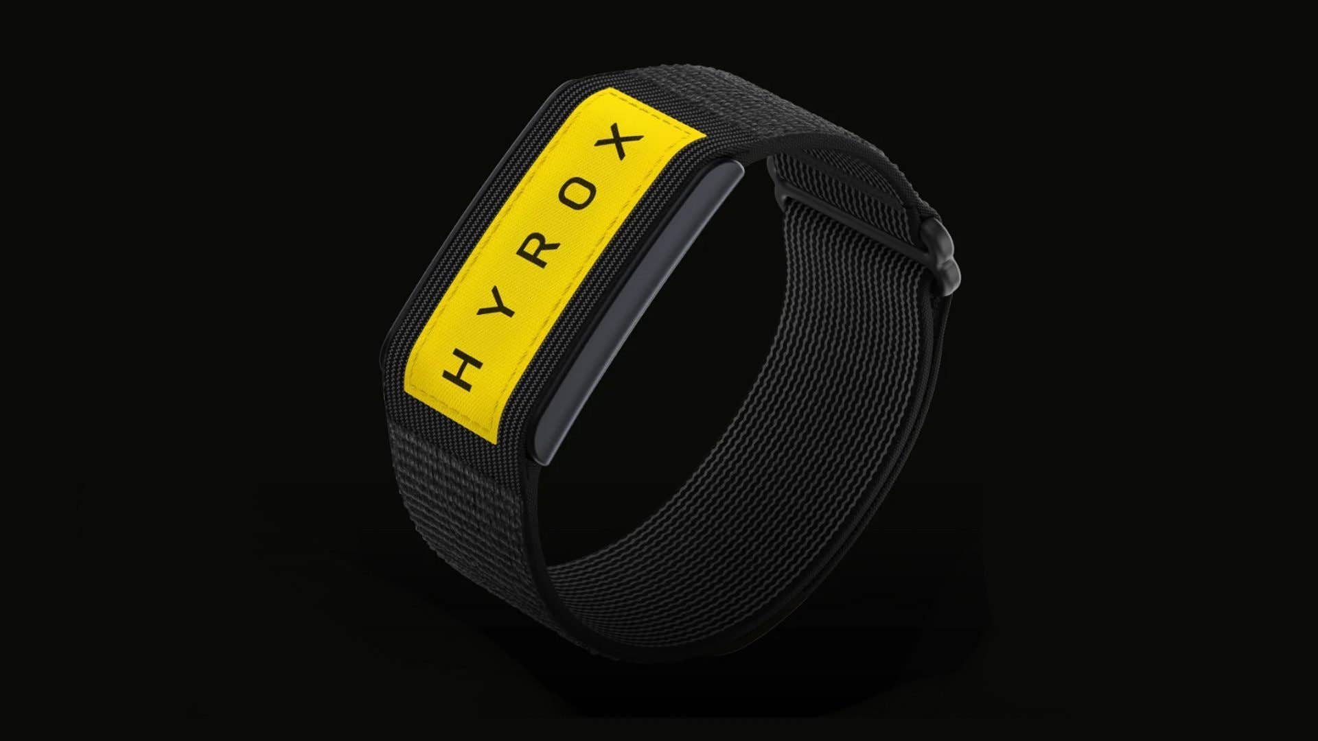 A black fitness band with a yellow label reading 'HYROX'.