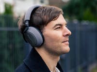 A person wearing a headphone in the street