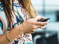 A person sending messages with a Nokia 3310