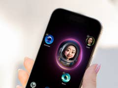 A person holds a smartphone displaying animated characters and a user profile named Layla.