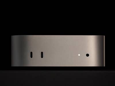 Apple Mac Mini M4 2024 viewed from the side, featuring two ports and a minimalist design.