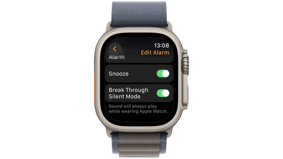 Apple Watch displaying alarm settings with options to snooze and break through silent mode.