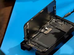 Apple's self-repair showing an iPhone 14 Pro being torn down