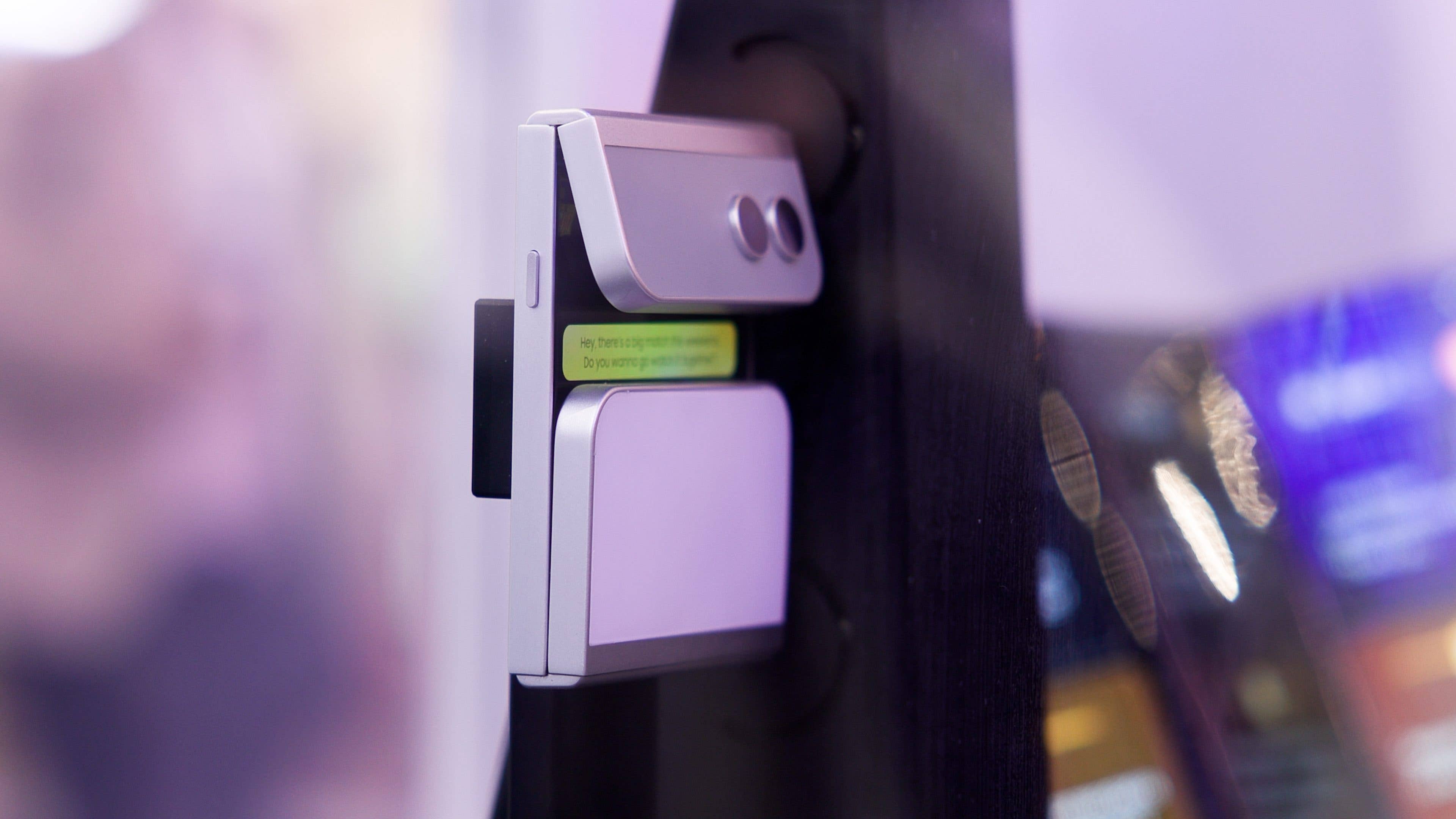 A Samsung asymmetric flip device with a small screen displaying a message.