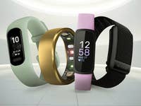 Three fitness trackers in various colors displaying heart rates and steps.