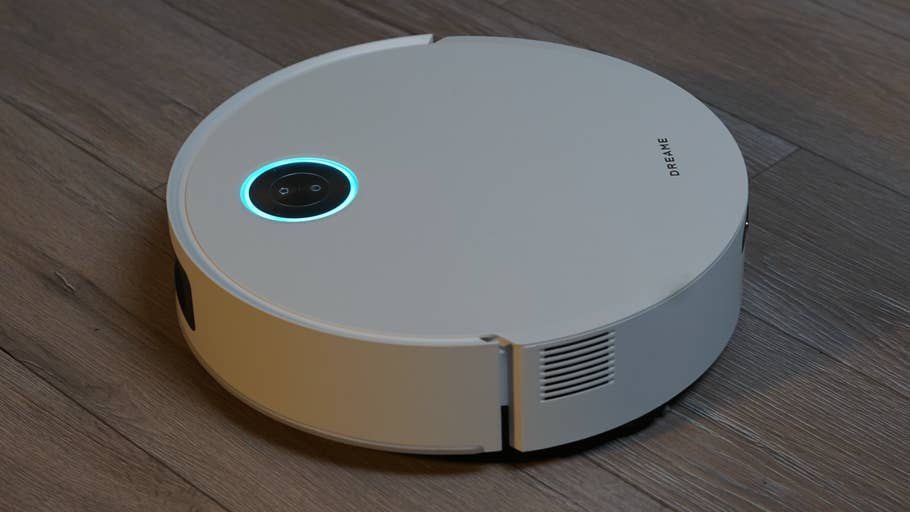 The Dreame Aqua10 Ultra Track robot vacuum cleaner on a wooden floor.