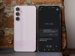 Samsung Galaxy A55 smartphone with a pink back and a dark screen displaying 'Hello, Jade'.