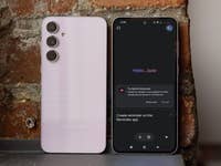 Samsung Galaxy A55 smartphone with a pink back and a dark screen displaying 'Hello, Jade'.