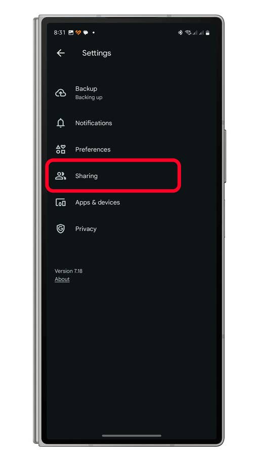 Settings menu on a smartphone with u0027Sharingu0027 option highlighted in red.