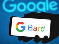A hand holding a phone with 