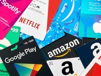 A collection of various gift cards including Amazon, Apple, Spotify, Netflix, and Google Play.
