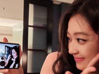 A person takes a selfie with the Magic V Flip closed