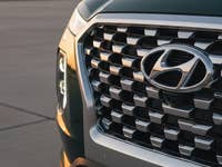 Front view of a 2020 Hyundai Palisade showcasing its grille and logo.