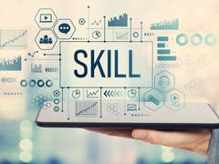 Skill sign with man holding a tablet computer