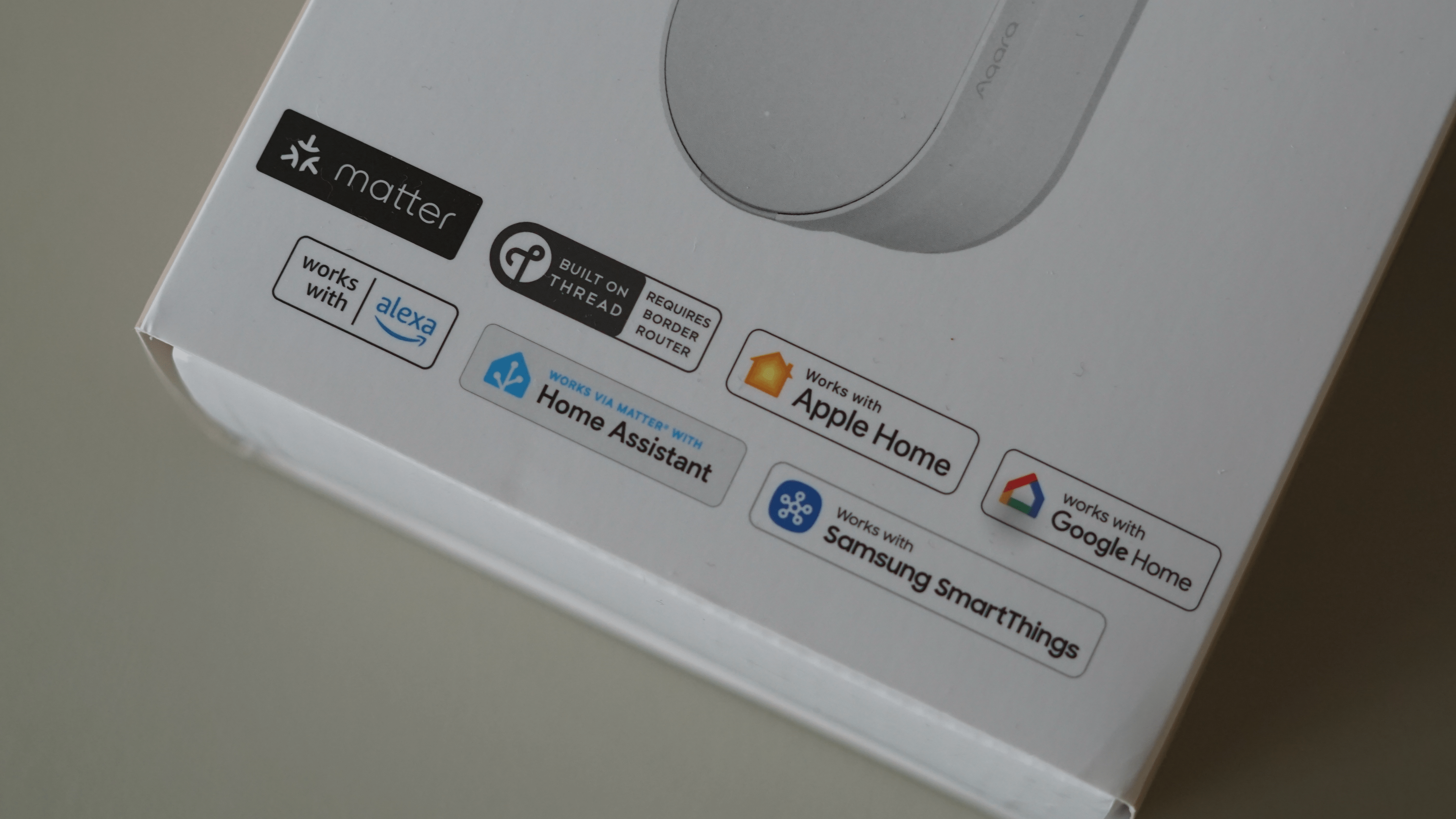 Product packaging featuring compatibility logos, including 'works with Alexa'.