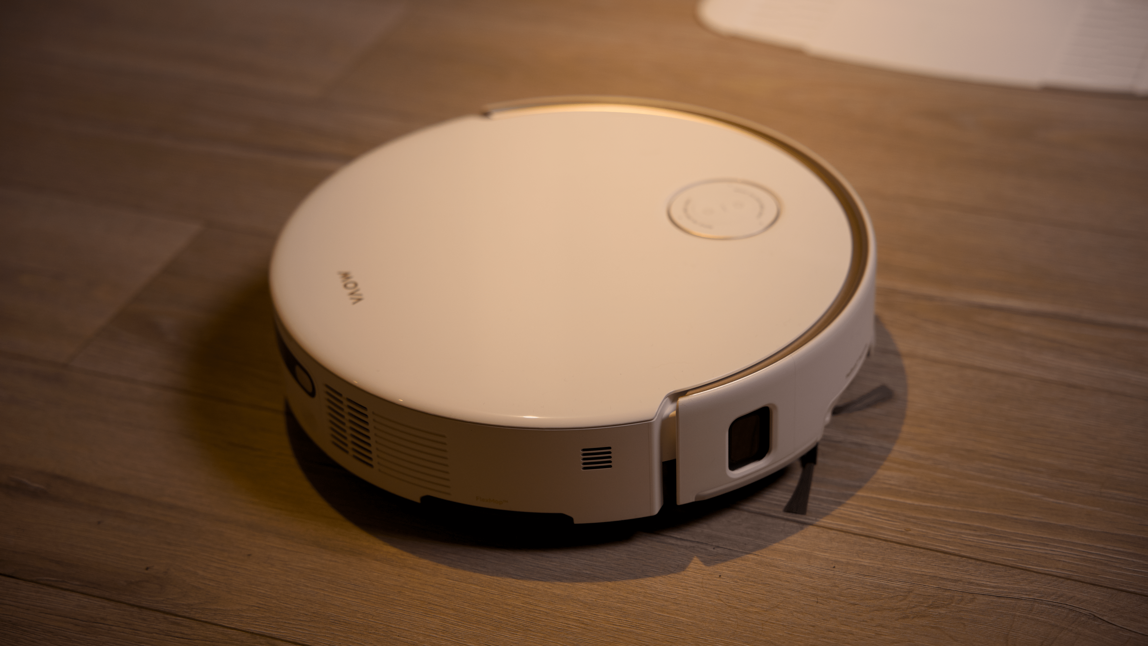 A Mova V50 Ultra Complete robotic vacuum cleaner on wooden floor.