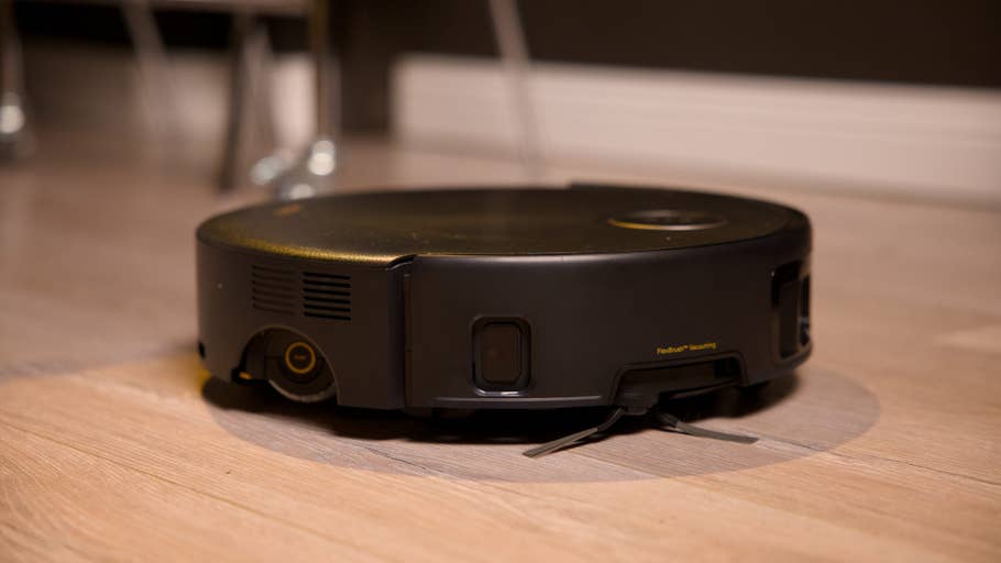A Mova Z60 Ultra Roller Complete robot vacuum cleaner on a wooden floor.