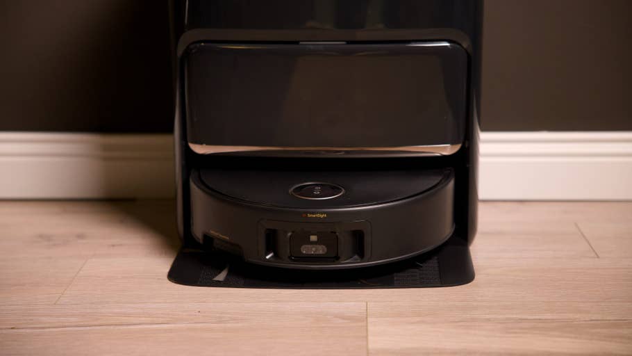 A Mova Z60 Ultra Roller Complete robot vacuum cleaner charging at a docking station.