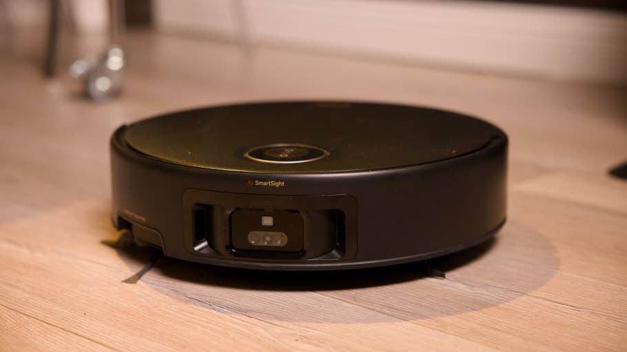 A Mova Z60 Ultra Roller Complete robot vacuum cleaner on a wooden floor.