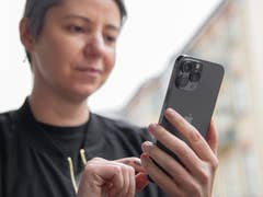 A person using the Apple iPhone 13 Pro Max