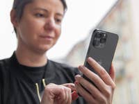 A person using the Apple iPhone 13 Pro Max