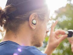 Google Pixel Buds being used by a person