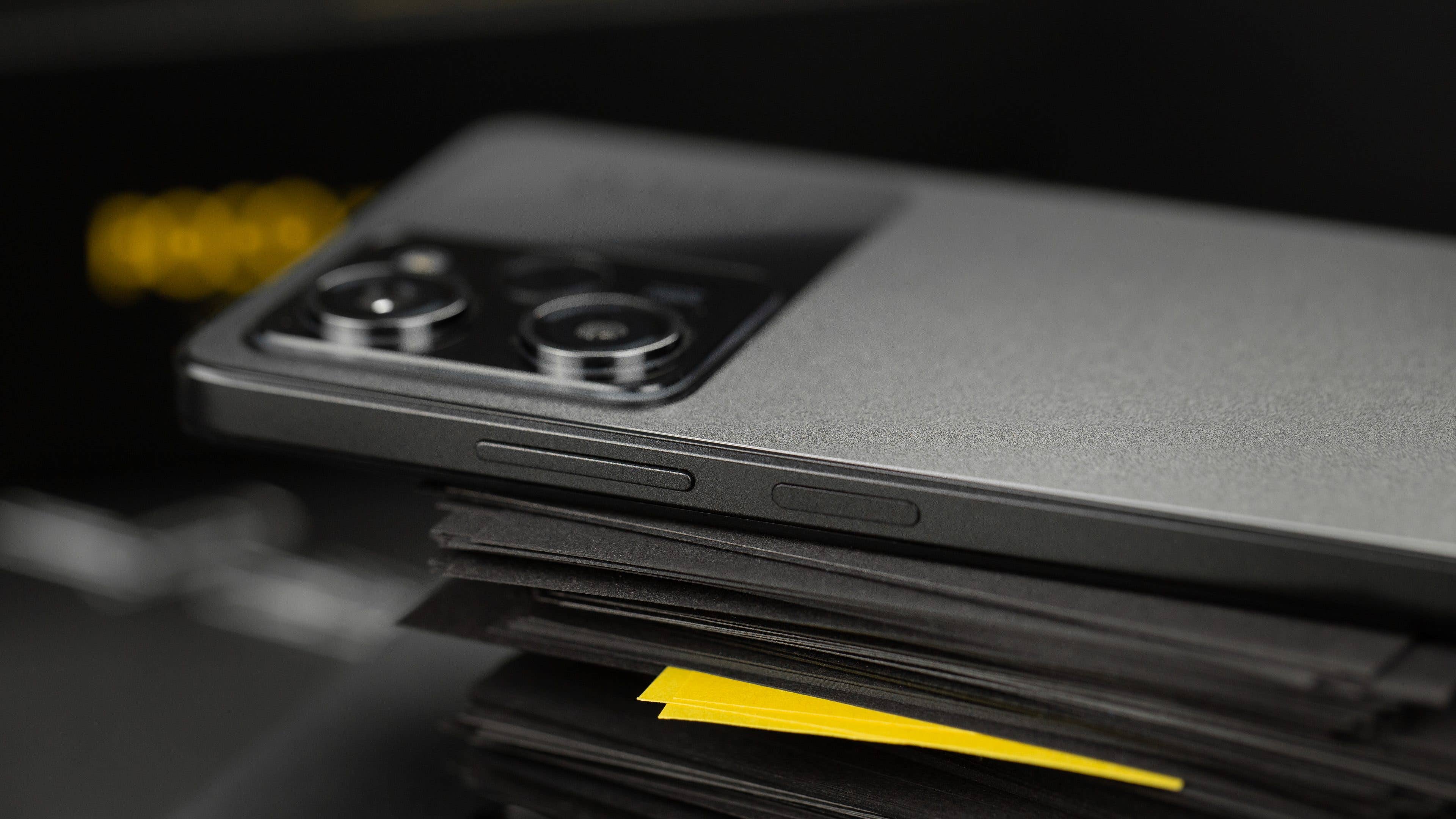 The side view reveals the side buttons and the protruding camera island. Poco X5 Pro buttons as viewed from the side