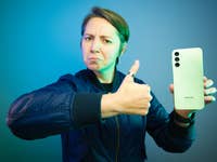 An editor holding the Samsung Galaxy A14 mimicking Brent Rambo meme
