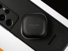 Samsung Galaxy Buds Pro charging case on top of a Galaxy S22 Ultra smartphone