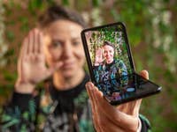 Semi-opened Samsung Galaxy Z Flip 3 displaying the camera app