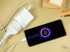 Xiaomi 11T Pro connected to its charging adapter