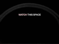 Black strap against a dark background with the text 'WATCH THIS SPACE' prominently displayed.