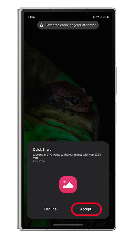 A smartphone screen displaying a Quick Share notification with options to decline or accept sharing images.