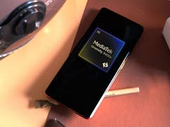 Realme smartphone with the Mediatek Dimensity 9400e SoC logo.
