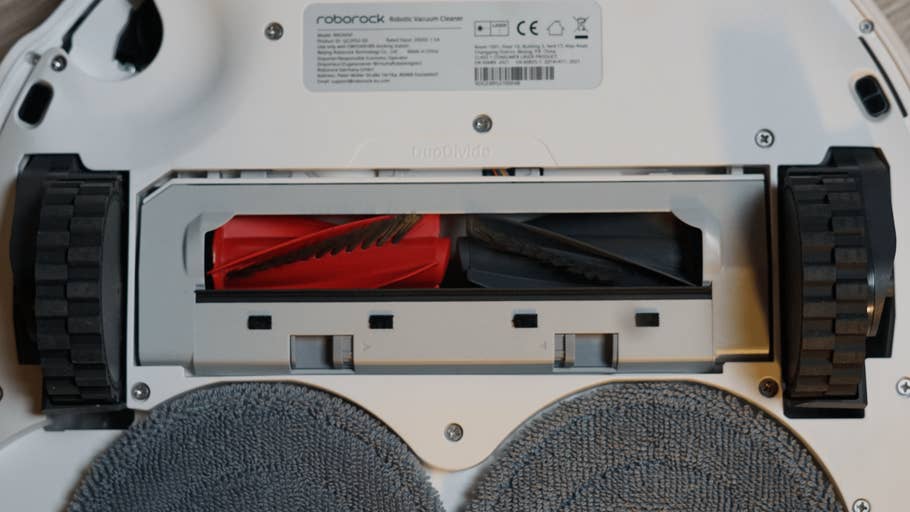 Close-up of the bottom of a Roborock Qrevo Curv 2 Pro robot vacuum cleaner.