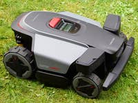 Roborock RockMow Z1 robotic lawn mower on grass.