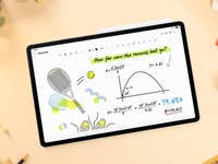 A Samsung Galaxy Tab S10 FE displaying a math problem about the trajectory of a tennis ball.