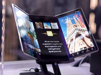 A Samsung Flex G device displaying a travel app with images and text about creating a special vlog for Spain.