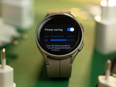 The Samsung Galaxy Watch 5 Pro highlighting the power saving mode feature setup in the display surrounded by power adapters.