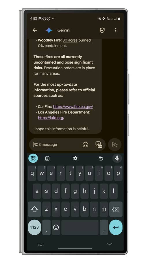 A smartphone screen displaying information about the Woodley Fire and official sources for updates.