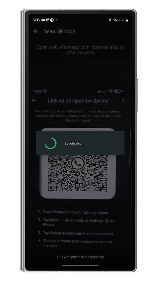 WhatsApp screen displaying a QR code for linking devices, with a u0027Logging in...u0027 message.