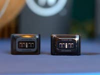 Two WHOOP devices on a table: one labeled 'WHOOP 5.0' and the other 'WHOOP MG'.