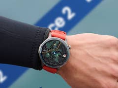 A smartwatch with a map display on a wrist, showing fitness tracking features.
