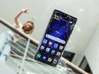 Damaged Android smartphone with a cracked glass