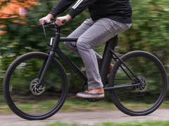 A person riding a Cowboy e-bike