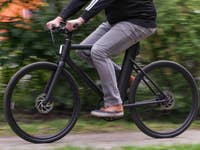 A person riding a Cowboy e-bike