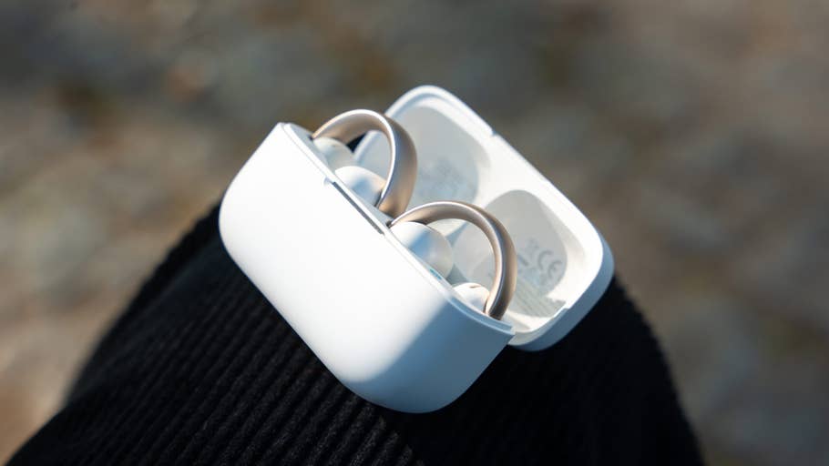 Close-up of Anker Soundcore Aeroclip earbuds in their charging case.