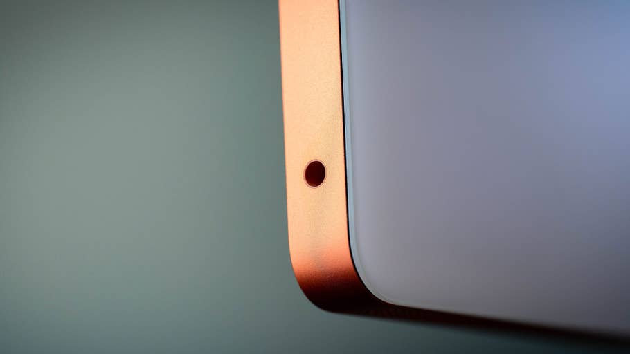 Close-up of the corner of an Apple iMac M4 2024, showing a tiny hole for the audio jack.